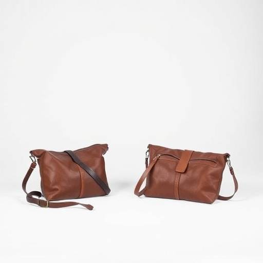 A product shot featuring handcrafted leather goods in a minimalist studio setting, used for a local Austin artisan's online store.